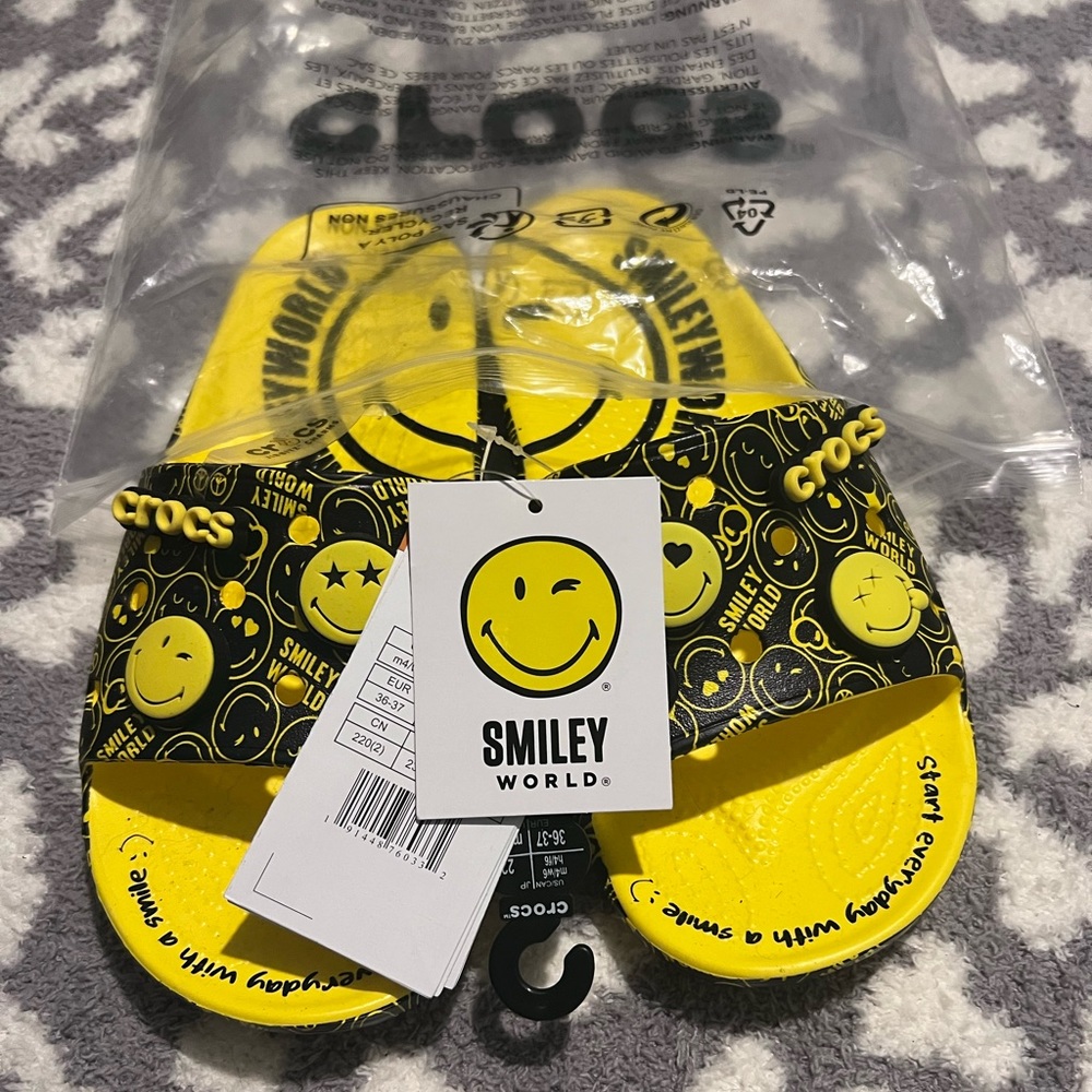 Smiley World Crocs slides. Brand new